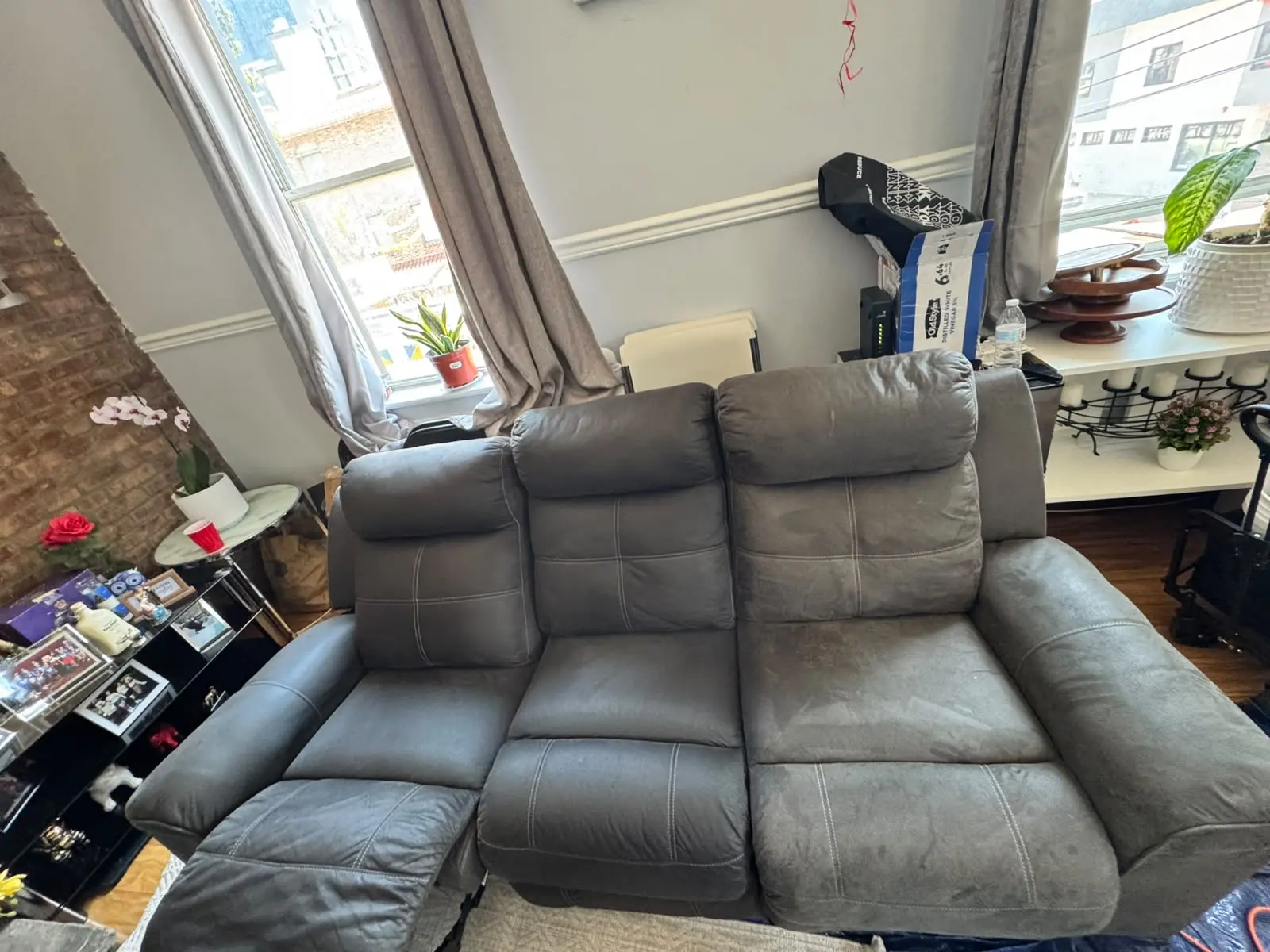 Gray sectional sofa during professional upholstery extraction by KC Pro Cleaning